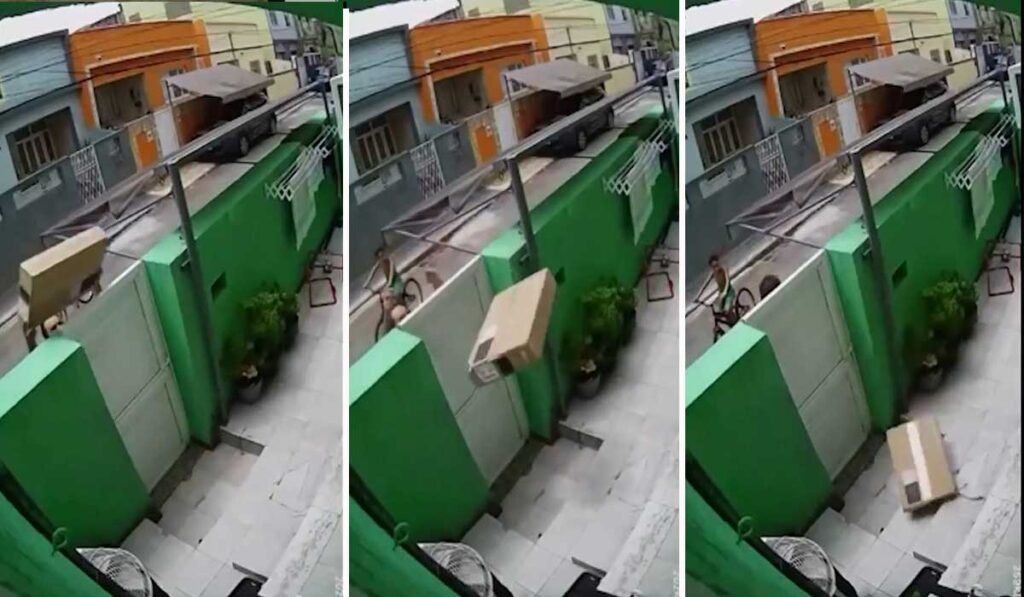 Vídeo flagra entregador arremessa caixa com TV por cima de portão de casa